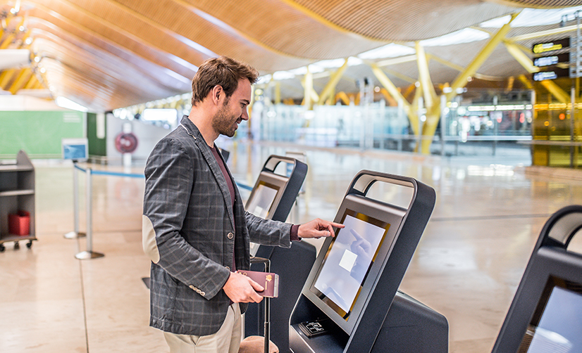 Using a self-service kiosk at Airport