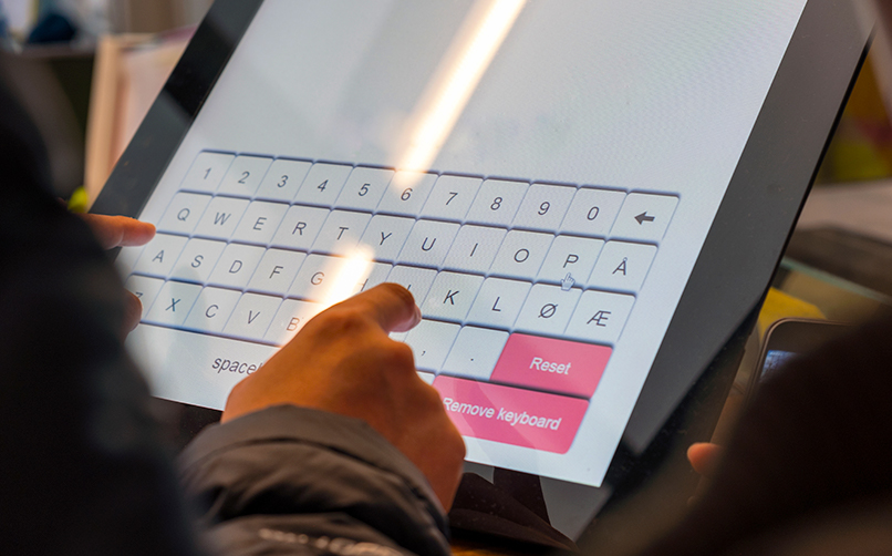 A consumer using an interactive kiosk