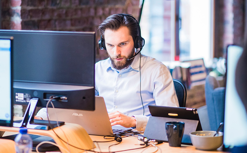Man working with Windows Laptop locked into Kiosk Man working with Windows Laptop locked into Kiosk