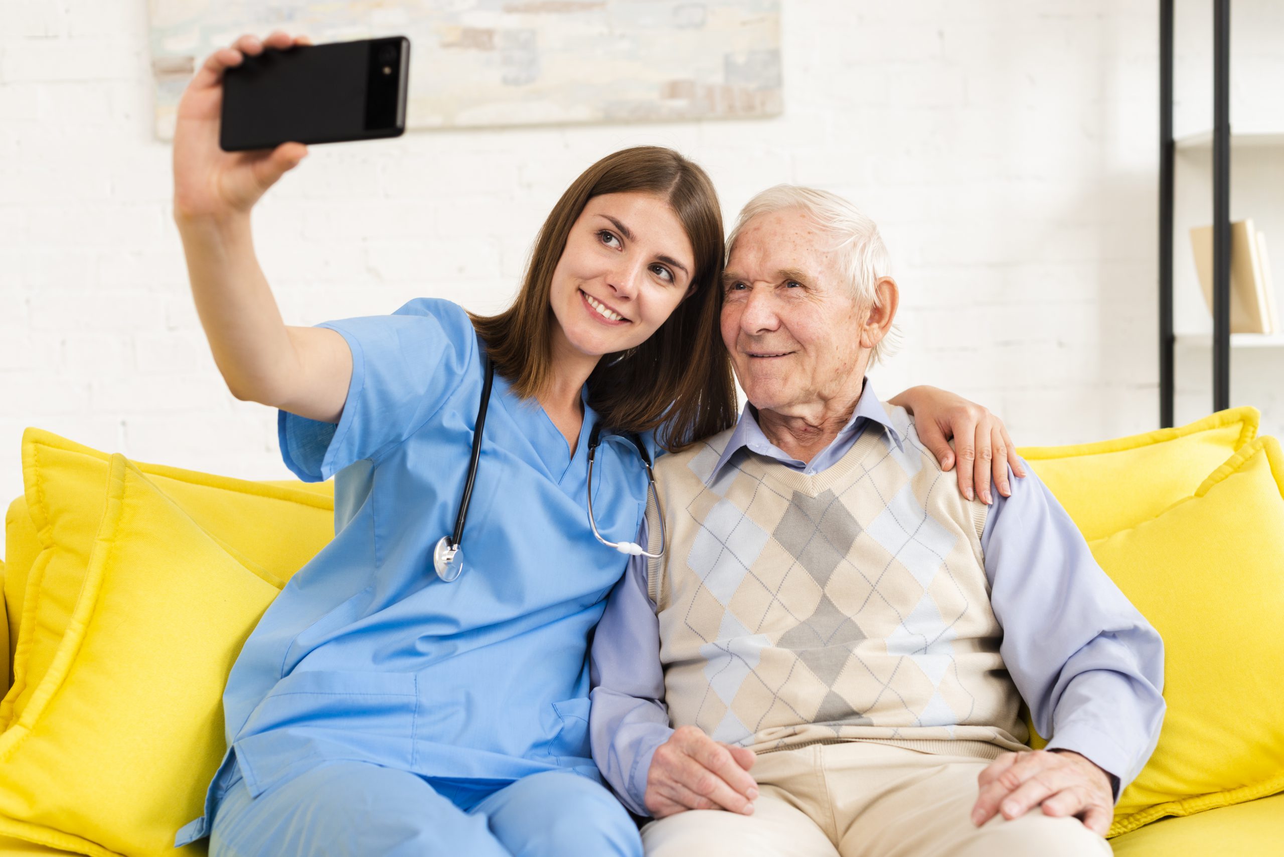 Nurse taking pic with resident