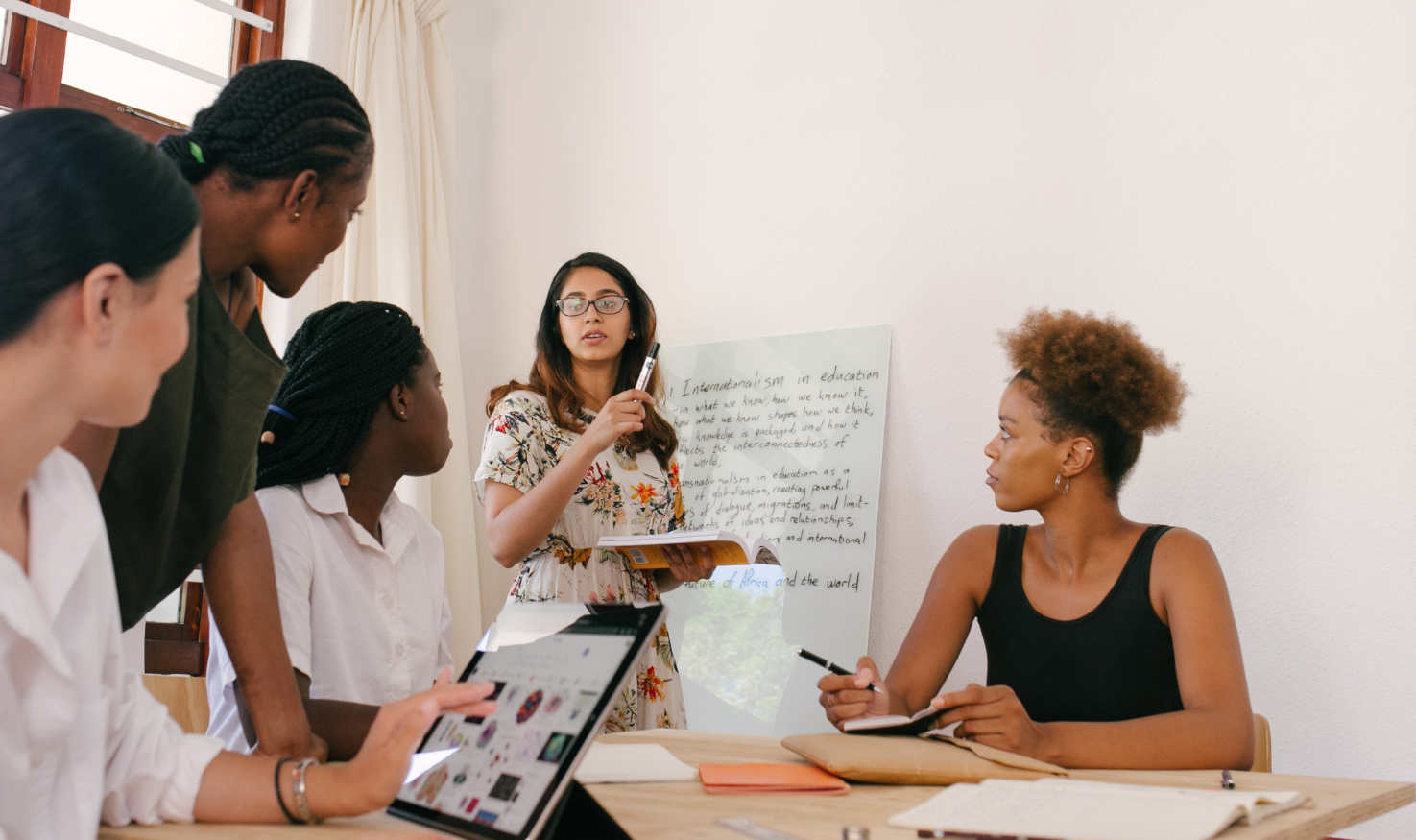 Students making use of shared ipads in classroom