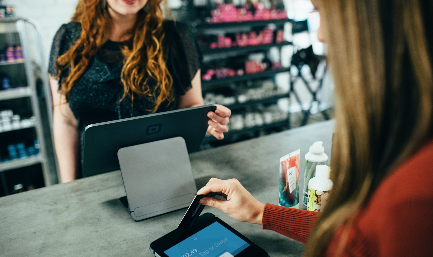 A customer making payment through a POS terminal