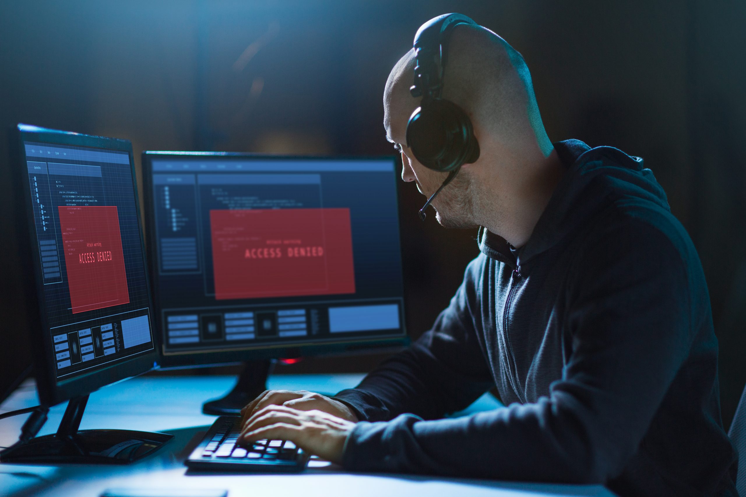 An 'access denied' screen pops up in the screen of a hacker