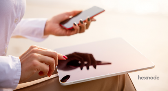 iOS vs iPadOS held by person