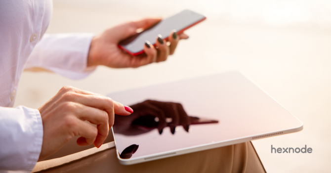 iOS vs iPadOS held by person