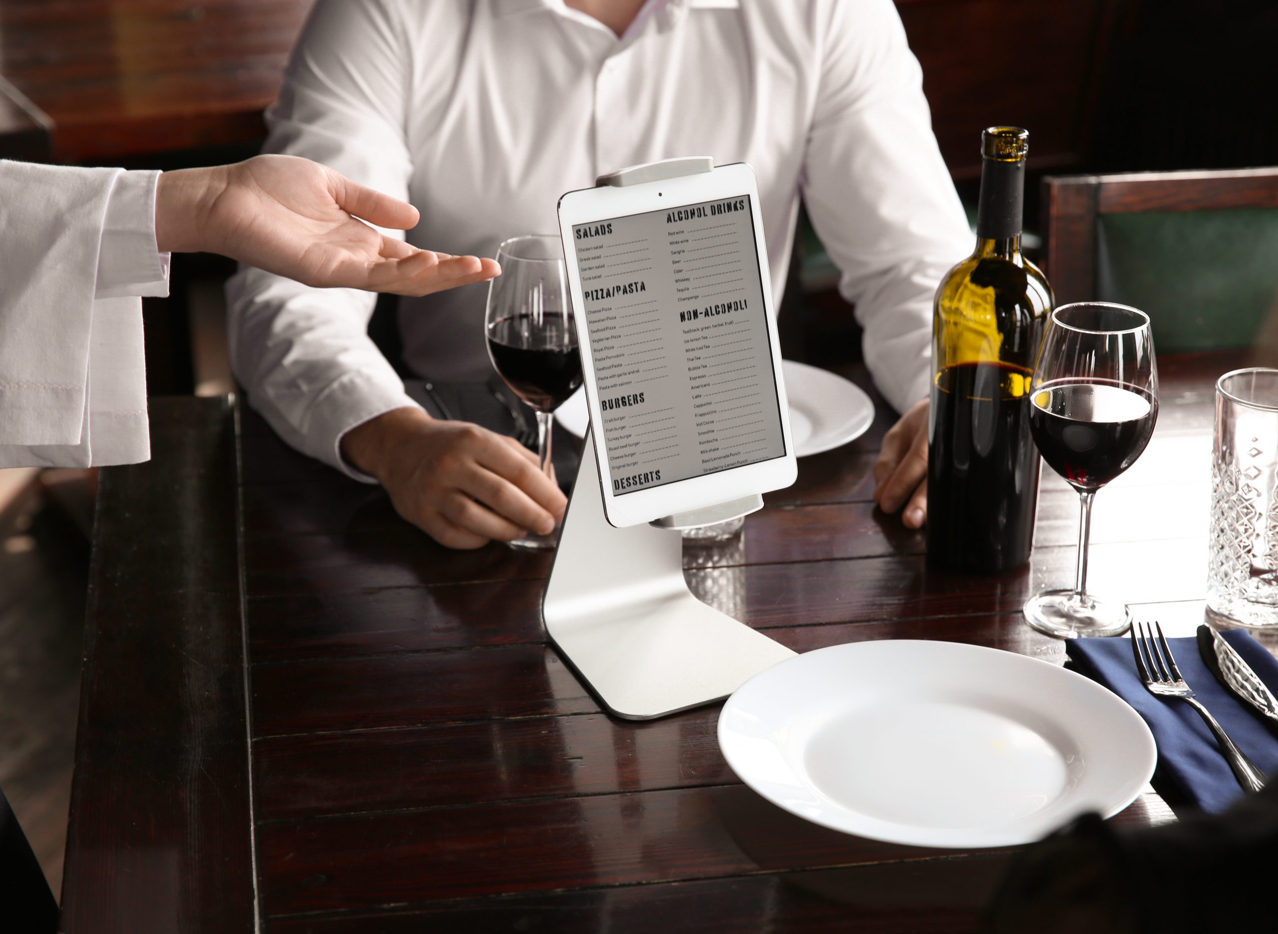Tablet displaying menu using software for hospitality industry