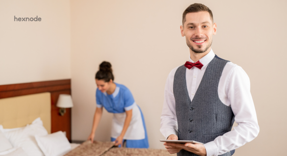 A hotel staff using device with software for hospitality industry