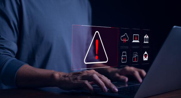 Cyber security warning alert system concept. Businessman working on laptop. Computer network hack, crime and virus, Malicious software, compromised information, illegal connection, data vulnerability,