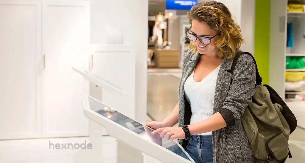 Image of a woman operating a machine in kiosk mode