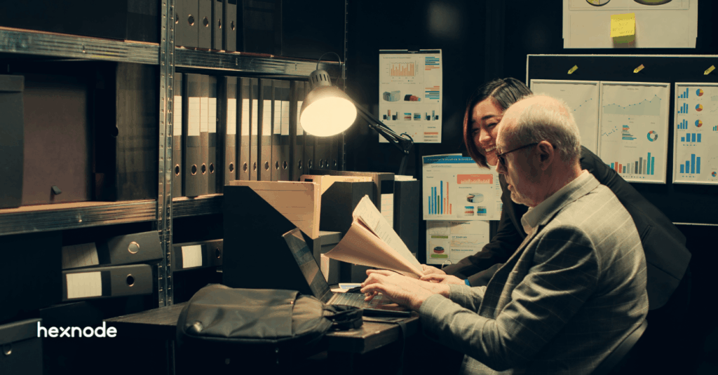 IT and security professionals reviewing endpoint compliance reports for a SOC 2 audit