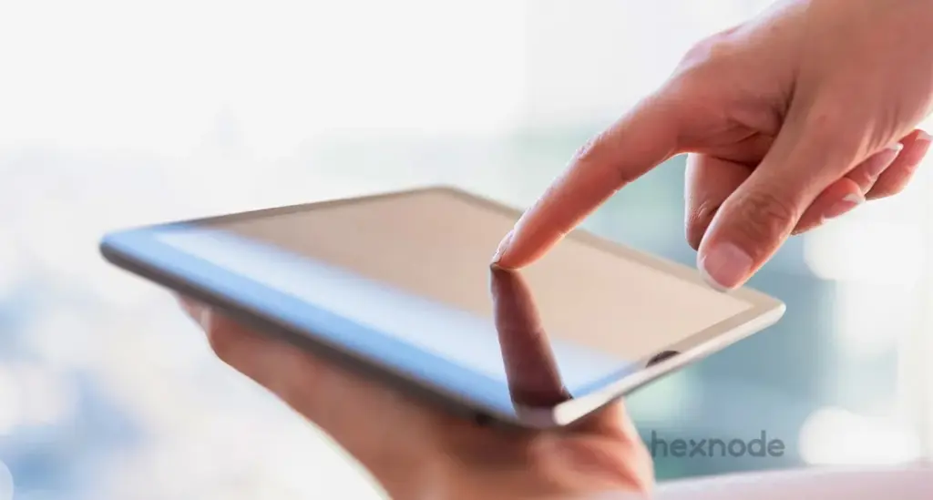 Image of a person holding a device locked in single app mode