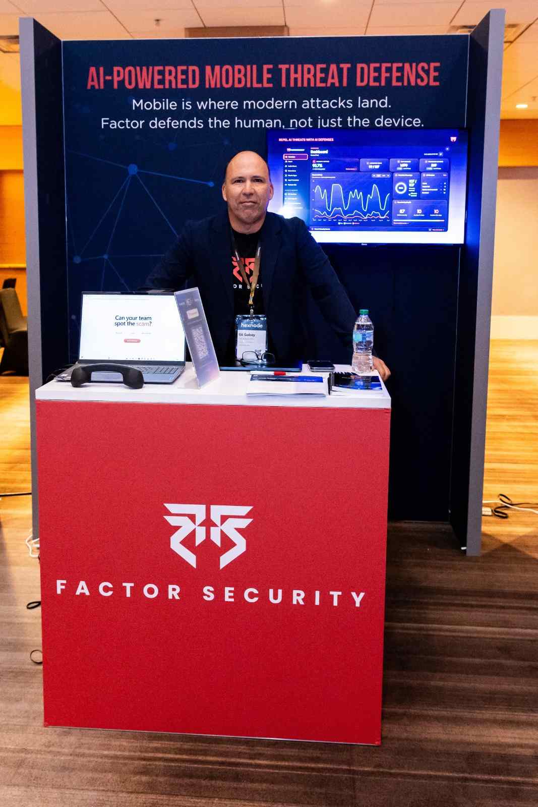 Factor Security booth at HexCon26 with Gil Gabay, featuring AI-powered mobile threat defense