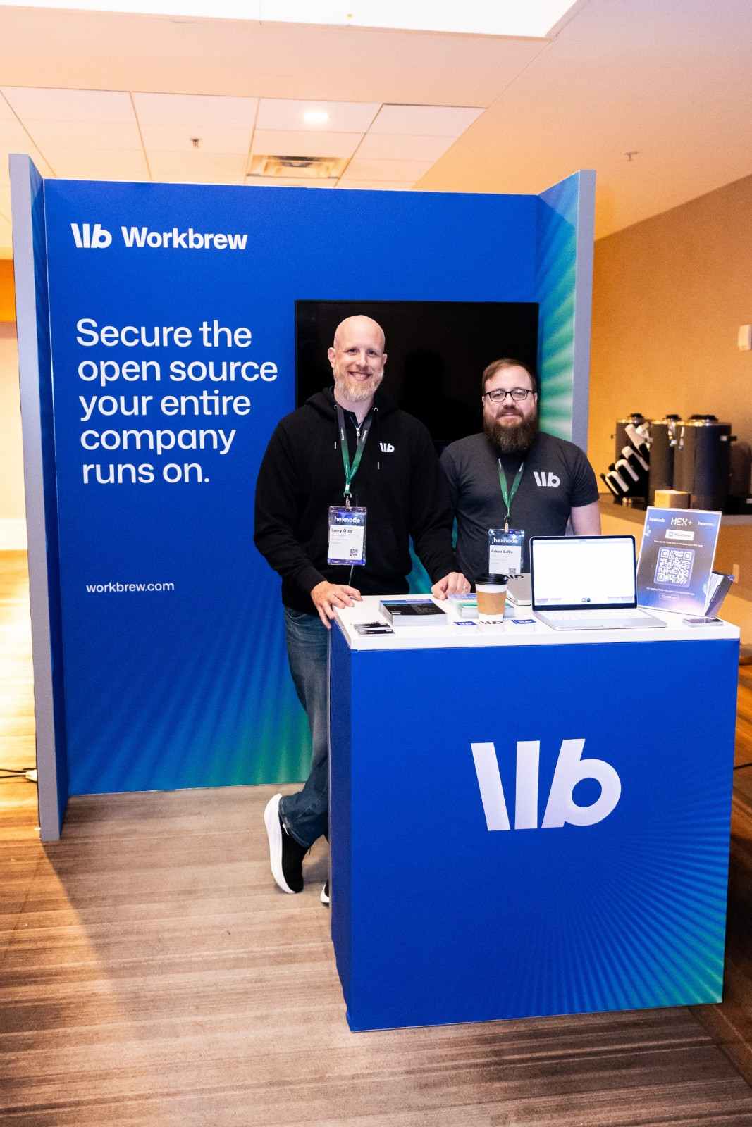 Workbrew booth at HexCon26 with Larry Otey and Adam Selby, promoting